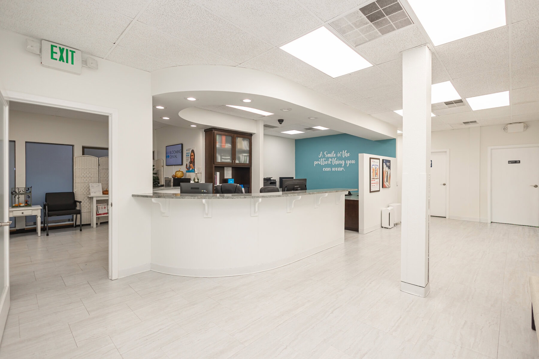 Front desk and waiting area at Blooming Dental