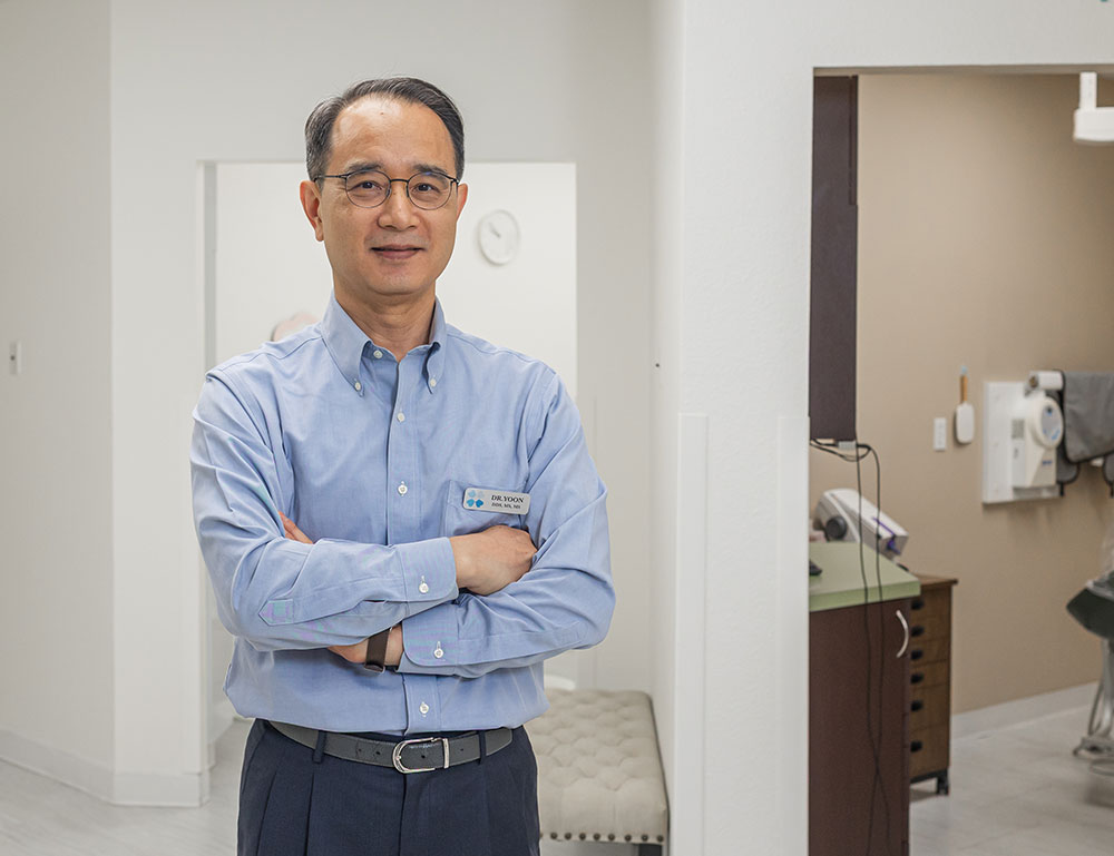Dr. Sung Wook Yoon, prosthodontist, at the Blooming Dental practice